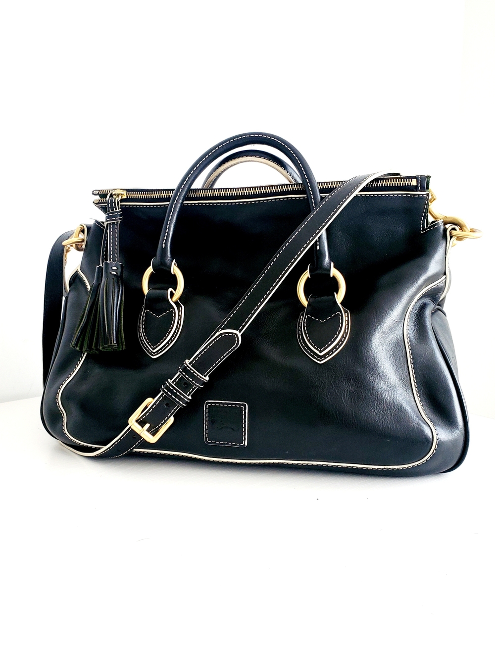 Dooney & Bourke Black Leather Satchel with Gold-Tone Hardware and Tassel